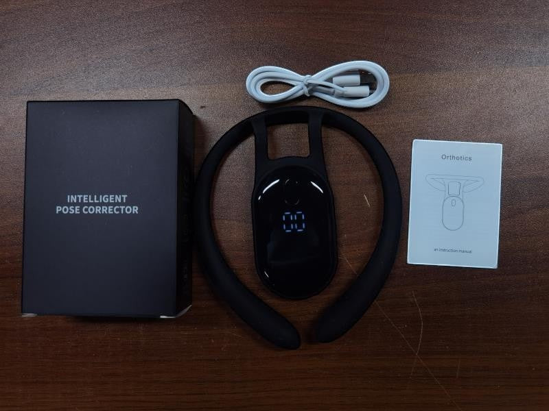 kainchhi black intelligent posture corrector with USB charging cable and instruction manual